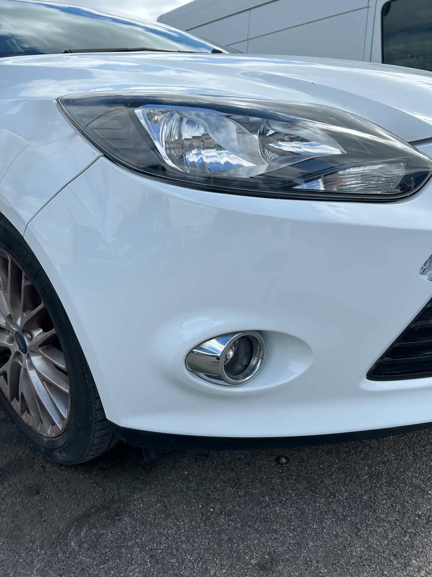 Same car after bodywork repair, front bumper scuffing removed