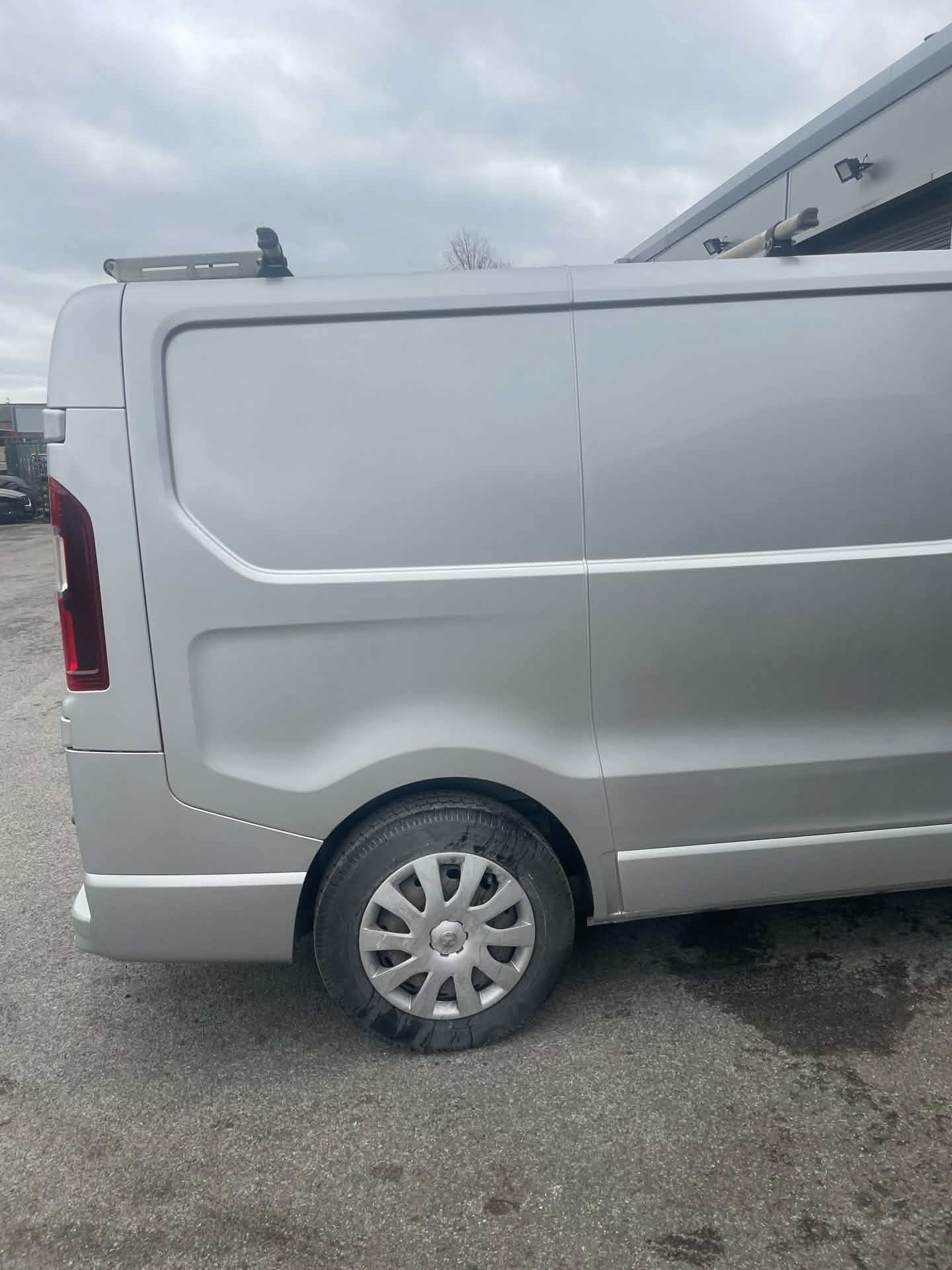 Same van rear quarter panel after bodywork repair, paintwork restored